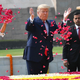 President Donald Trump and First Lady Melania Trump spray rose petals to pay tribute at Raj Ghat, the memorial for Mahatma Gandhi, in New Delhi, India on February 25, 2020.